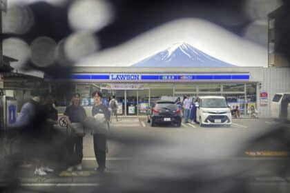 Hole-y Moly! Tourists Poke Through Japan's Mount Fuji Screen