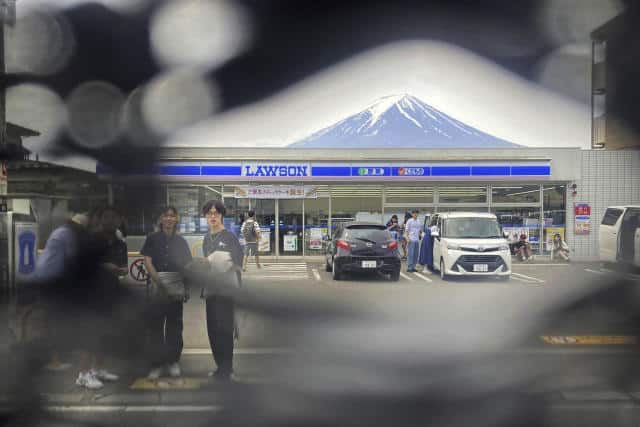 Hole-y Moly! Tourists Poke Through Japan's Mount Fuji Screen