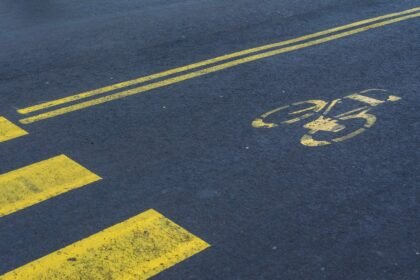 Illustrative stock photo: road markings, car