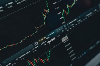 Close-up of stock market trading screen displaying financial growth and charts.