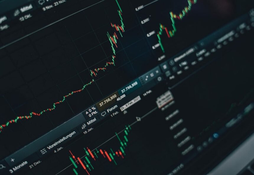 Close-up of stock market trading screen displaying financial growth and charts.