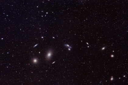 Captivating image of distant galaxies and star clusters in the vast universe. Perfect for astronomy enthusiasts.
