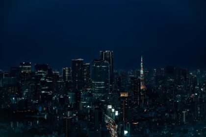 Stunning nighttime view of Tokyo skyline with illuminated Tokyo Tower in Shibuya, Japan.