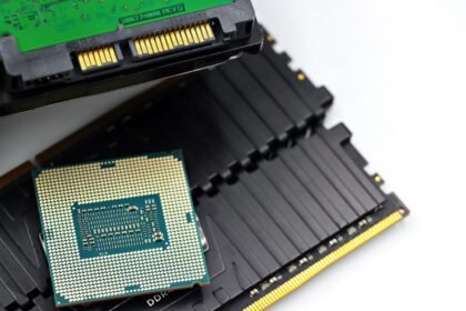 Detailed view of a CPU chip and RAM modules, illustrating computer hardware components.