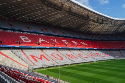 Explore the iconic Allianz Arena in Munich, home to FC Bayern, captured empty and sunlit.