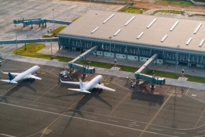 Aerial view of Abeid Amani Karume International Airport in Zanzibar, showing parked airplanes and terminal.