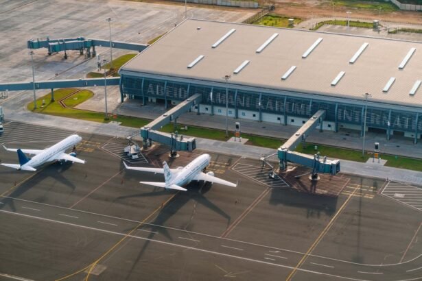 Aerial view of Abeid Amani Karume International Airport in Zanzibar, showing parked airplanes and terminal.