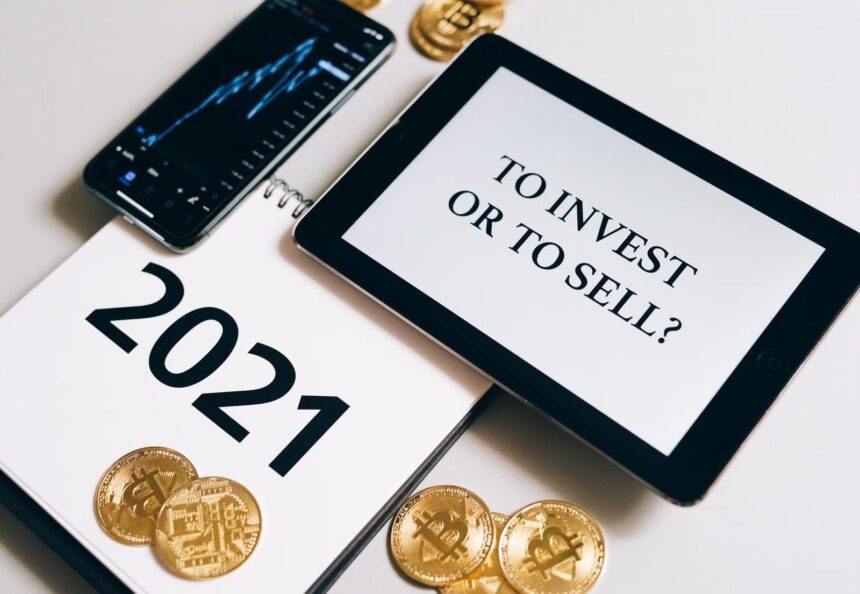 Bitcoin and investment strategy visualized with smartphone, tablet, and coins.